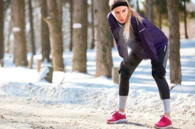 Image of a woman working out outside during winter on the National Personal Training Institute website