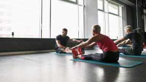 People stretching with a personal trainer