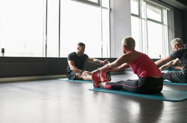 People stretching with a personal trainer