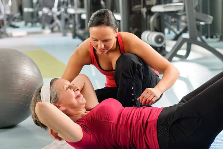 Image of a personal trainer working with a woman.