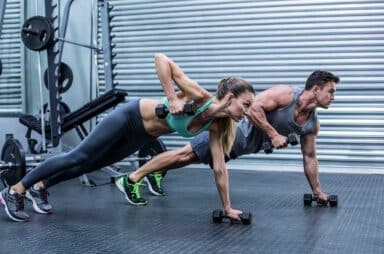 Couple doing plank exercise together